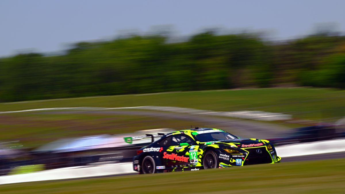 Lexus GT3 cars 12 and 14 in tight formation on the racetrack.