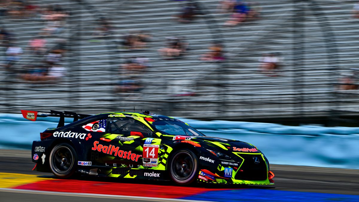 Lexus GT3 taking a curve on the racetrack.