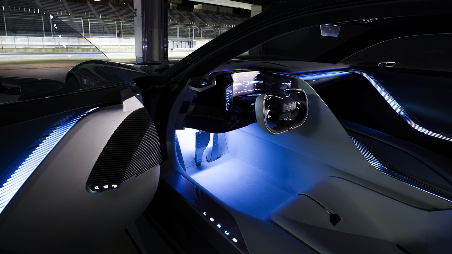Side profile silhouette of LFA Concept in a moody, dimly lit studio.