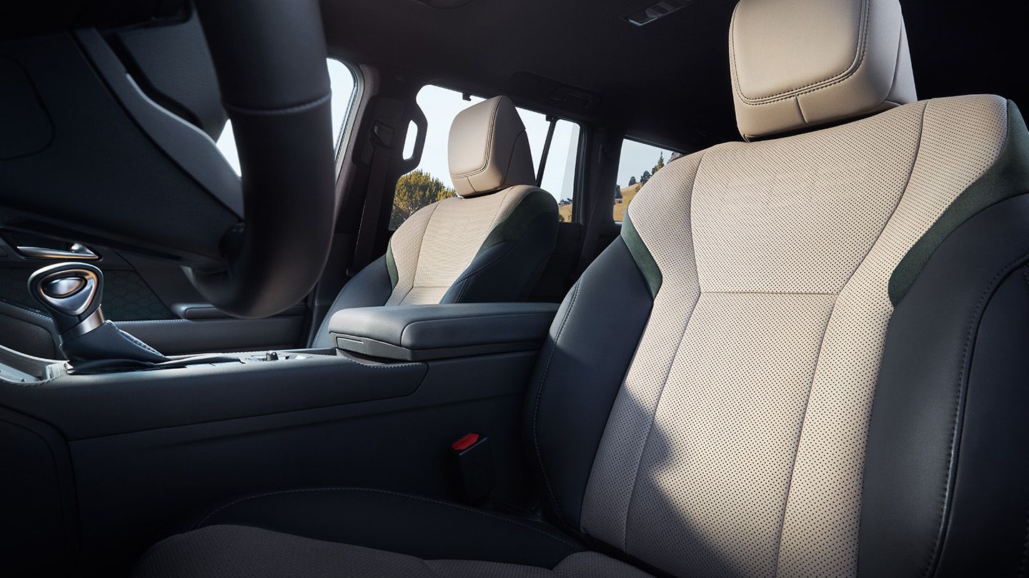 Overtrail seating surfaces include perforated Ultrasuede upholstering.