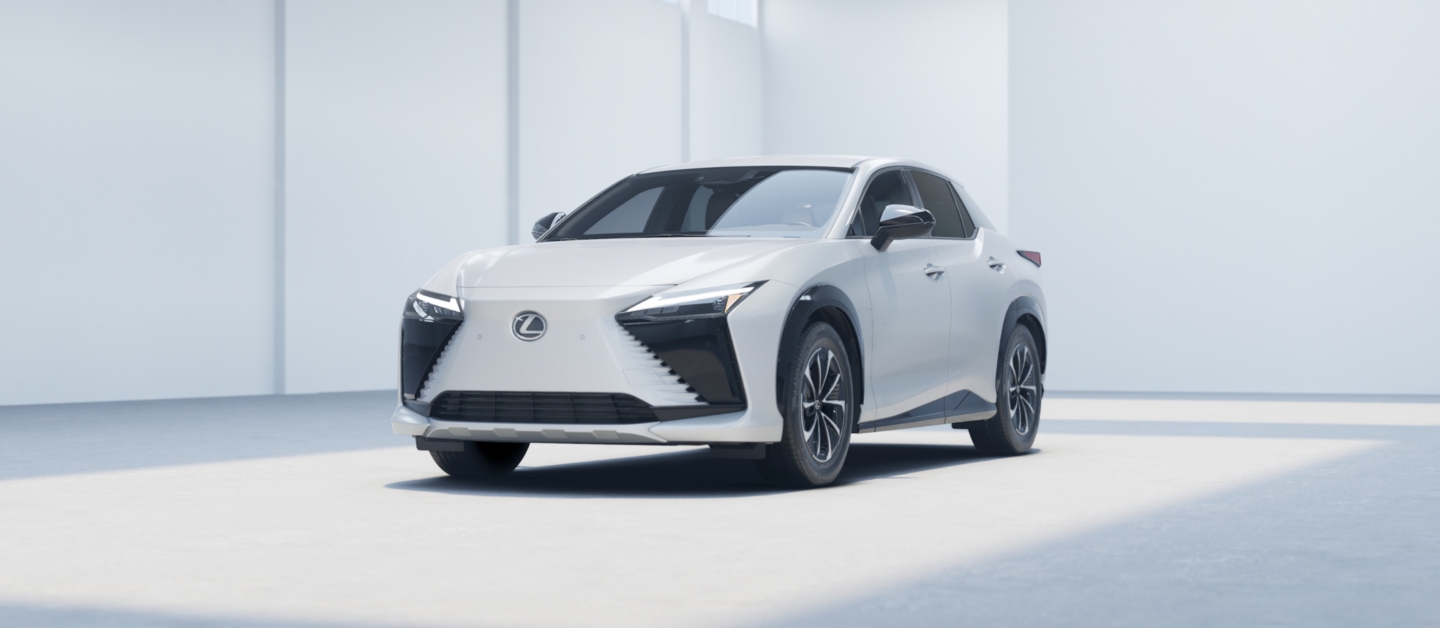 Lexus RZ with Oxygen White EXTERIOR, 18-in five-spoke alloy wheels with Dark Gray Metallic and machined finish angle 1
