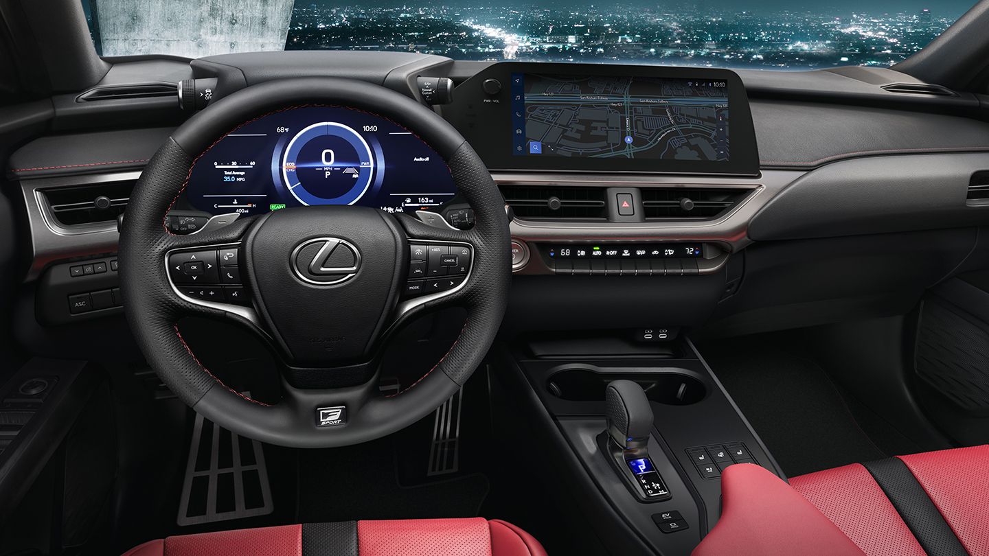 F SPORT steering wheel and multimedia screen controls.